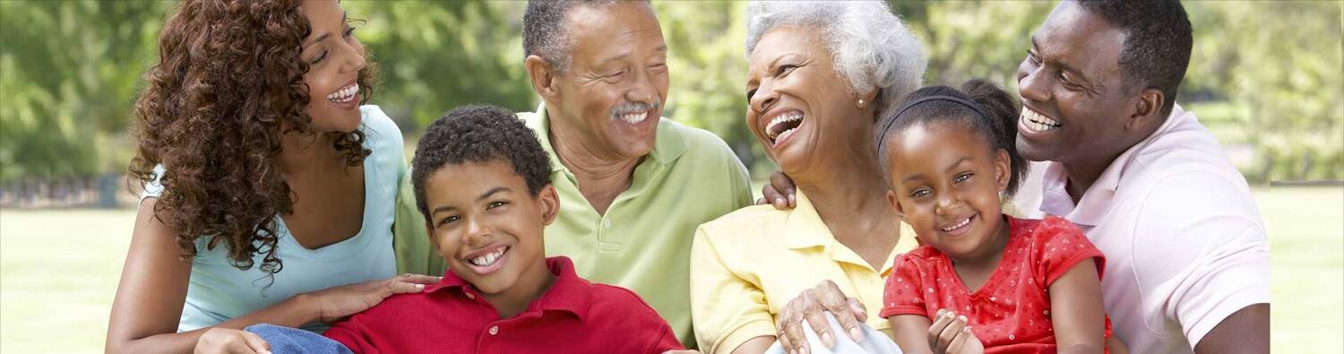 Three generations of family members laughing together